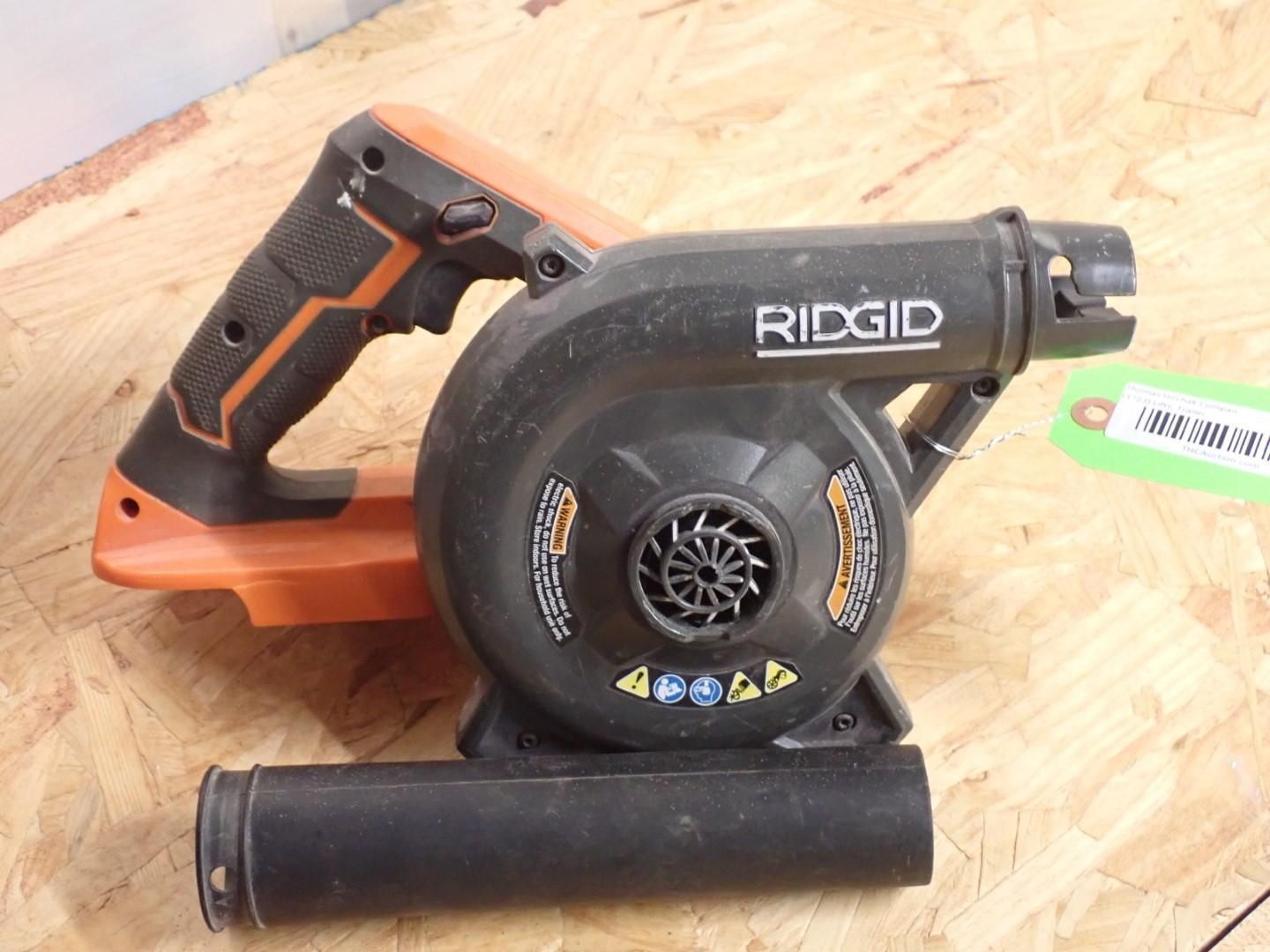 Black and orange Ridgid handheld blower on a wooden surface.