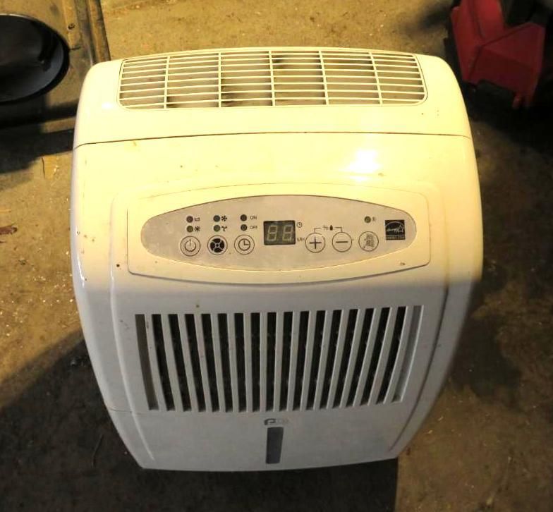 White dehumidifier, top view, with control panel and front air vents.