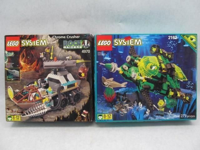 Two LEGO System boxes: Rock Raiders Chrome Crusher and Aquazone Sea Scorpion.