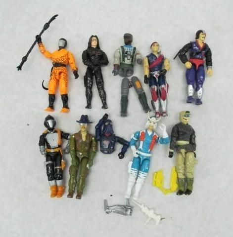 Collection of vintage action figures, various colors, some with accessories.