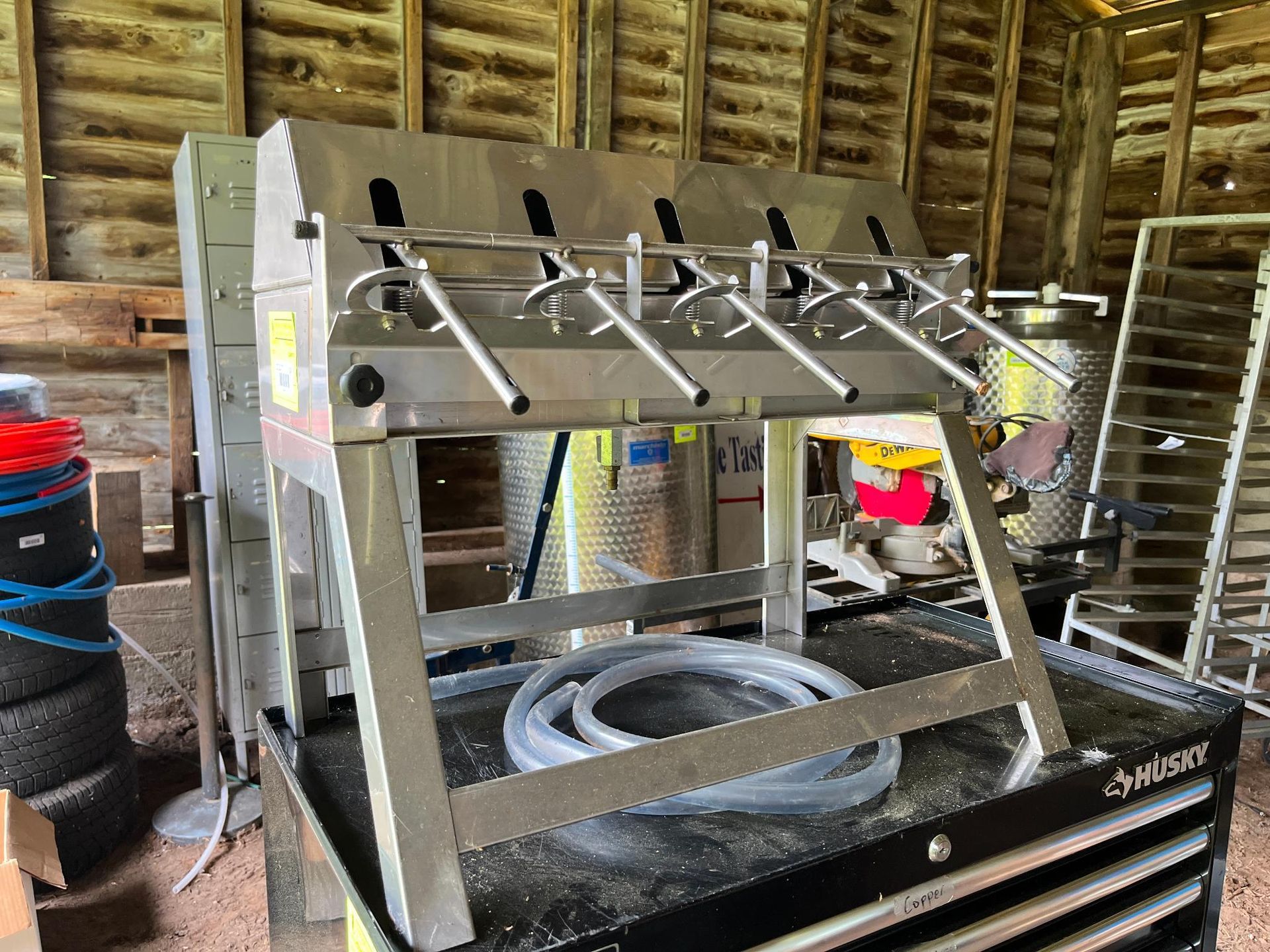 Stainless steel bottling machine.
