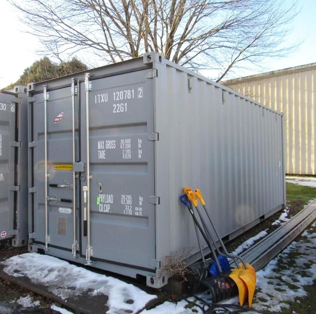 Gray shipping container outside.