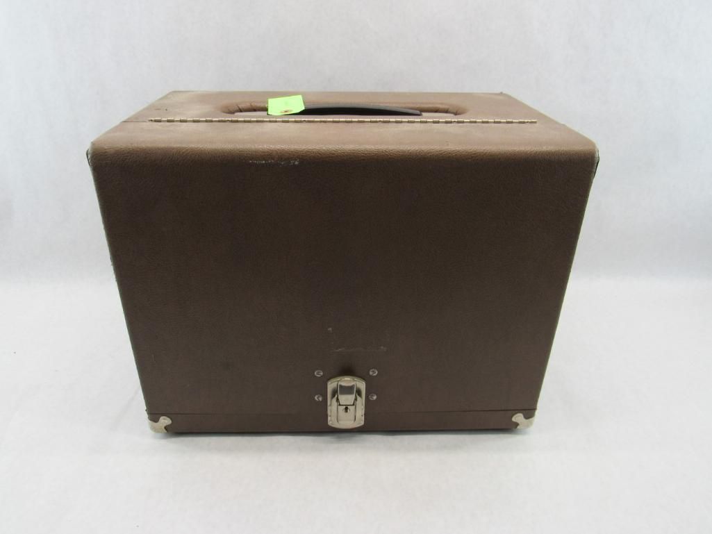 Brown square vintage suitcase with handle and clasp.
