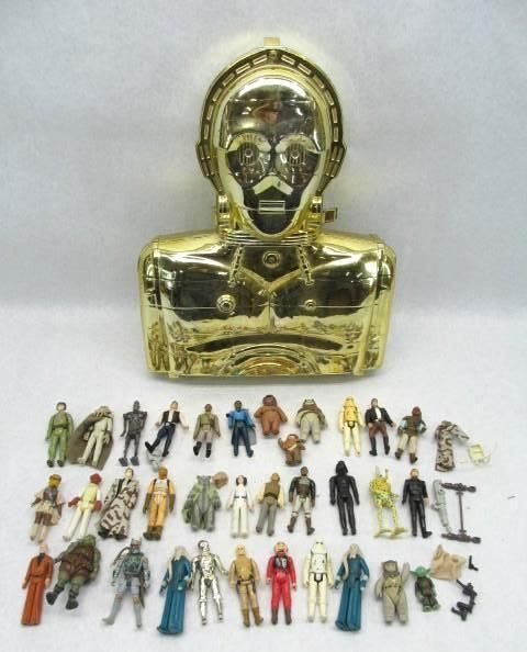 C-3PO head-shaped toy case with 35 assorted Star Wars action figures.