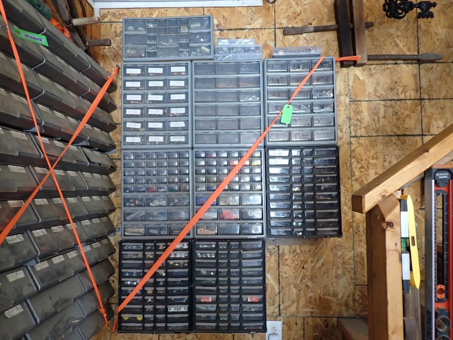 Workshop shelves filled with small parts drawers and organizers, seen from above.