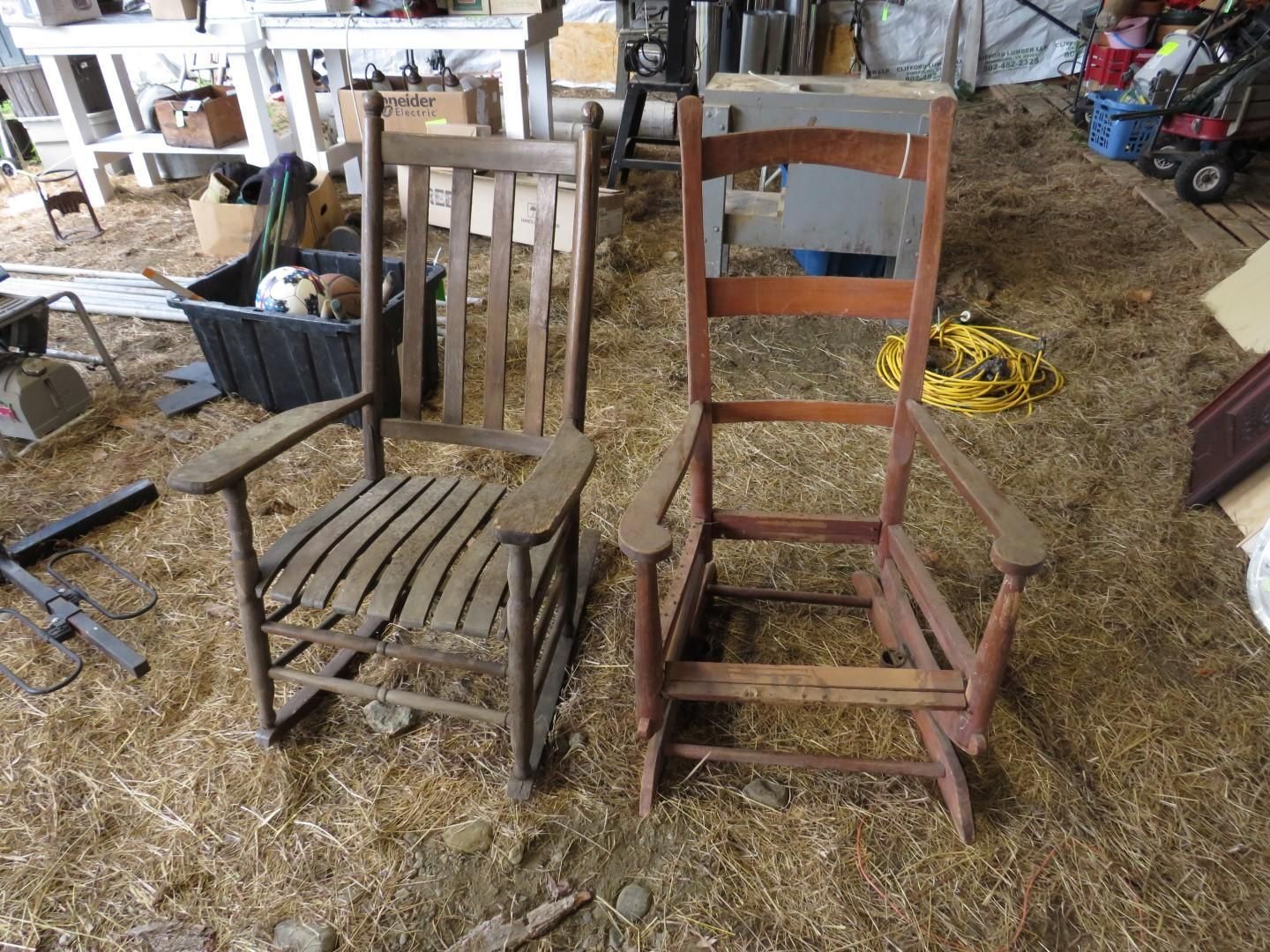 Two wooden rocking chairs side-by-side, one appears older.
