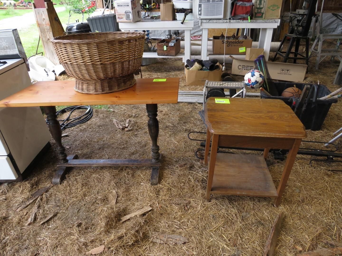 Two wooden tables, one with basket.