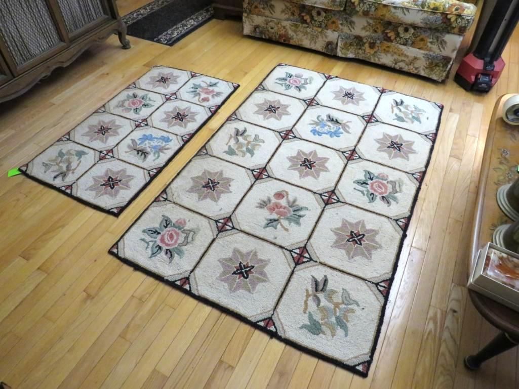 Two floral needlepoint rugs on hardwood floor.
