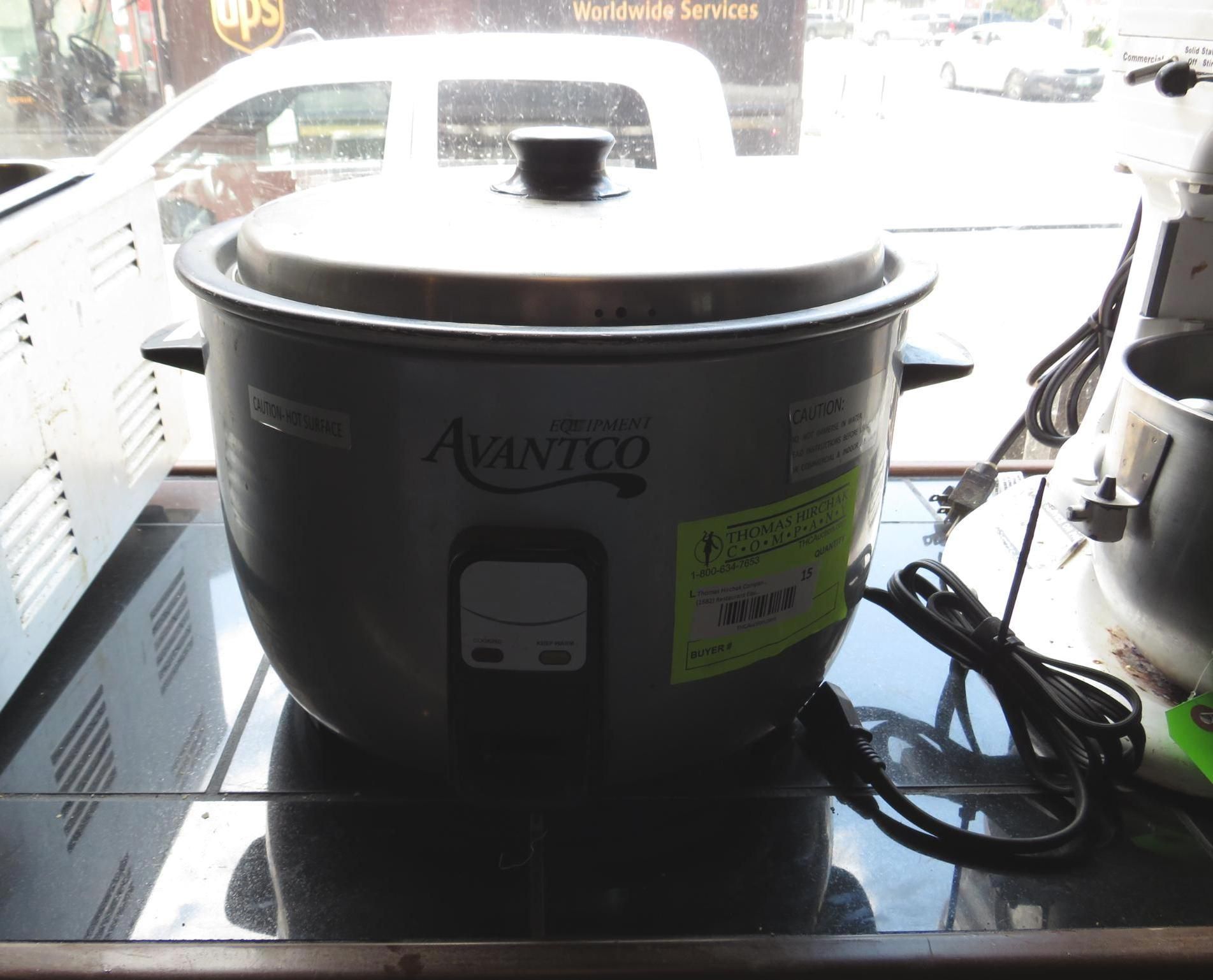 A silver Avantco rice cooker with a black lid and power cord sitting on a shelf.