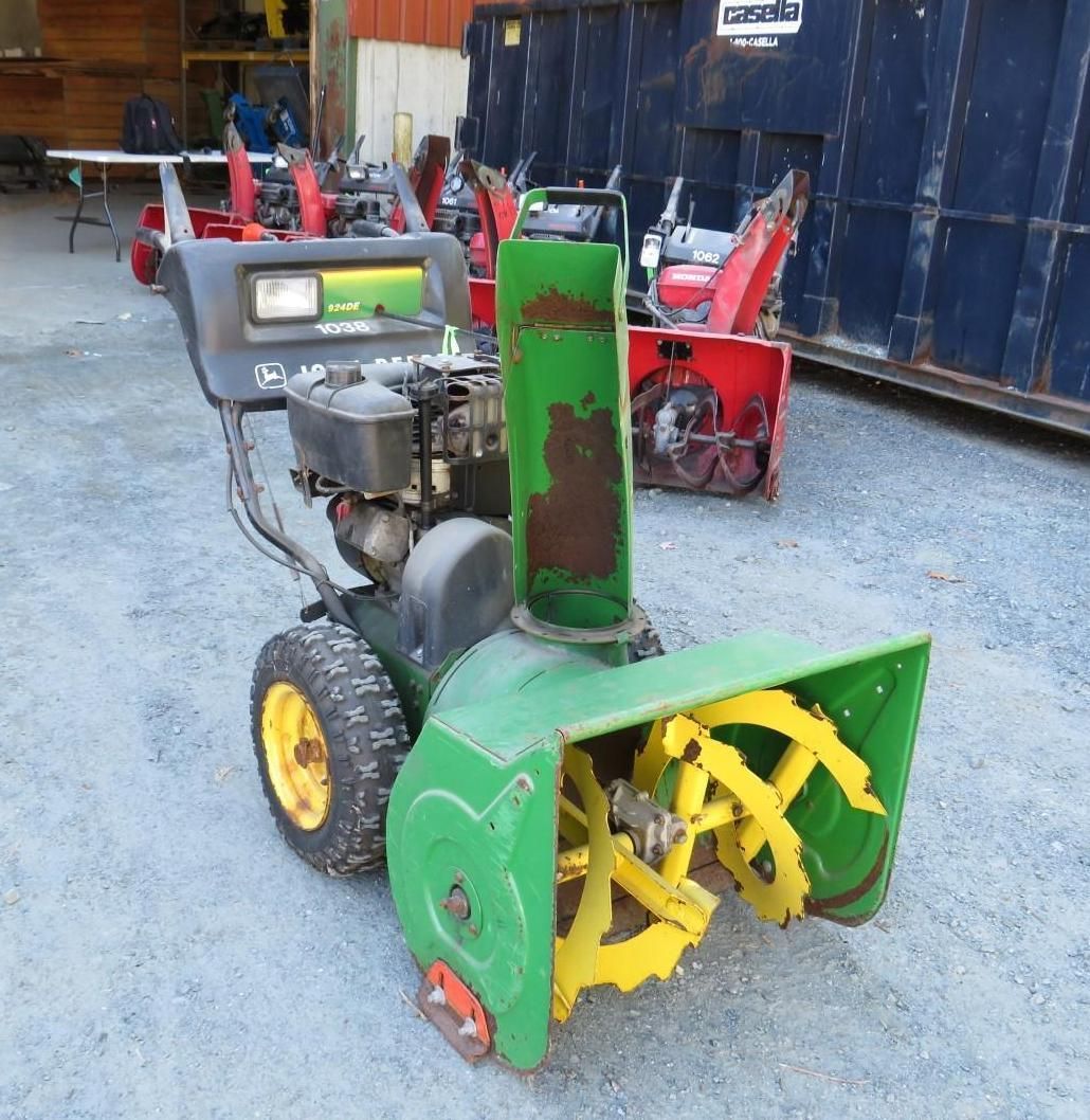 Green and yellow John Deere snowblower.