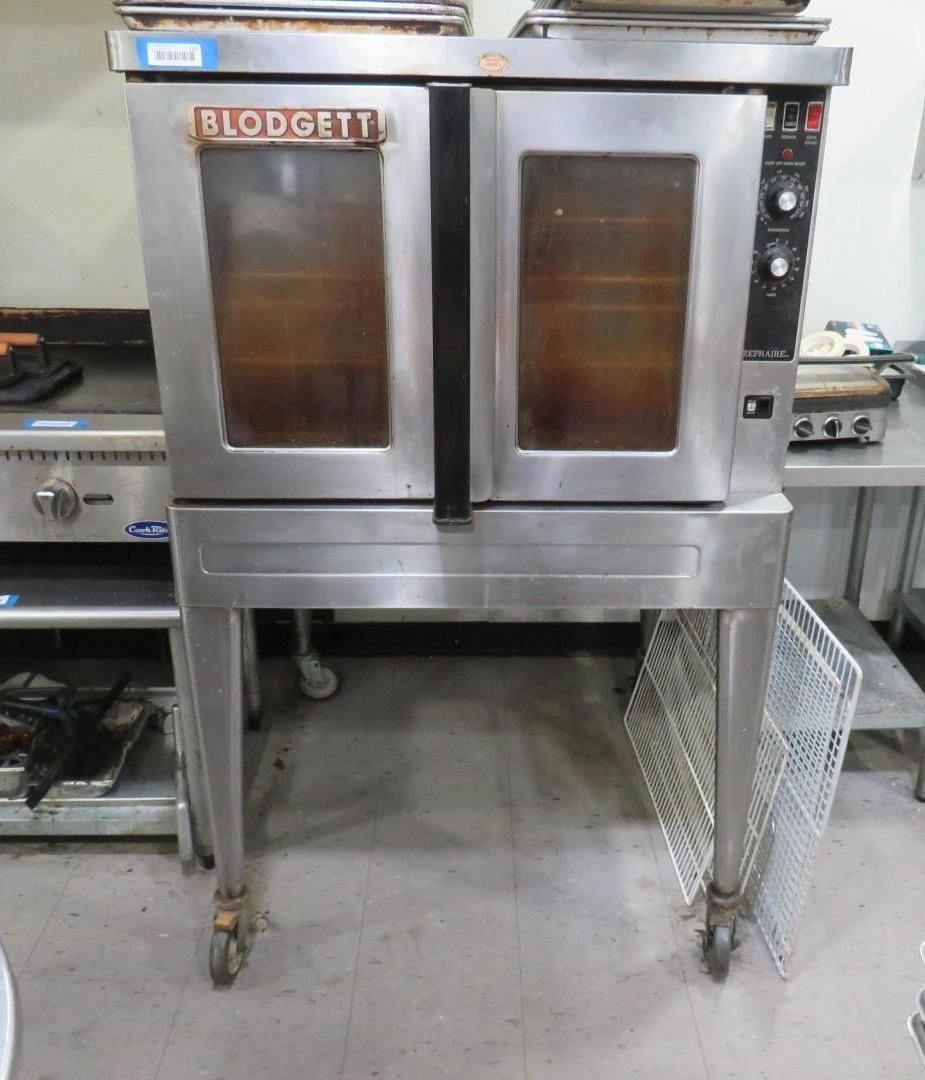 Stainless steel Blodgett commercial oven on legs, two door design, control panel on right.