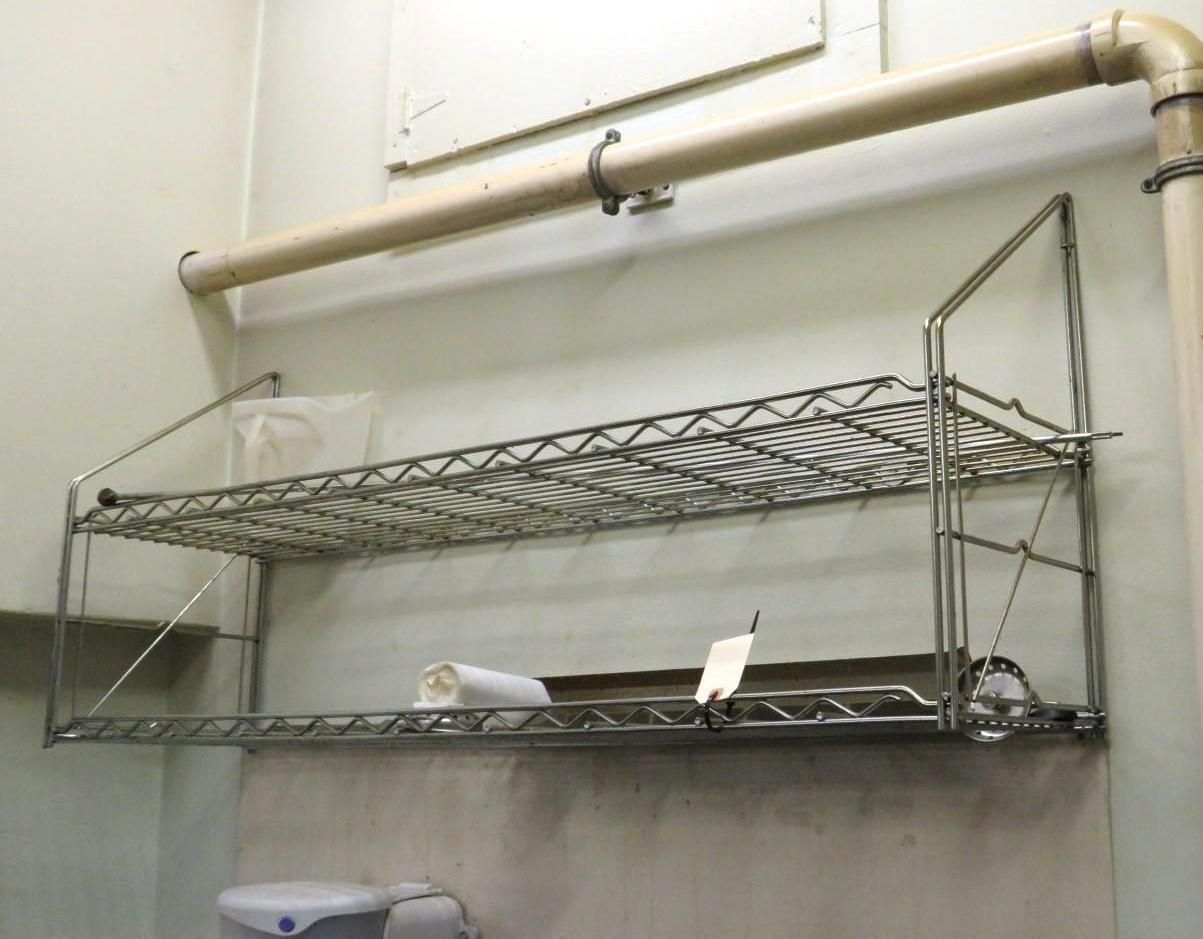 Metal wire shelving mounted on a wall.