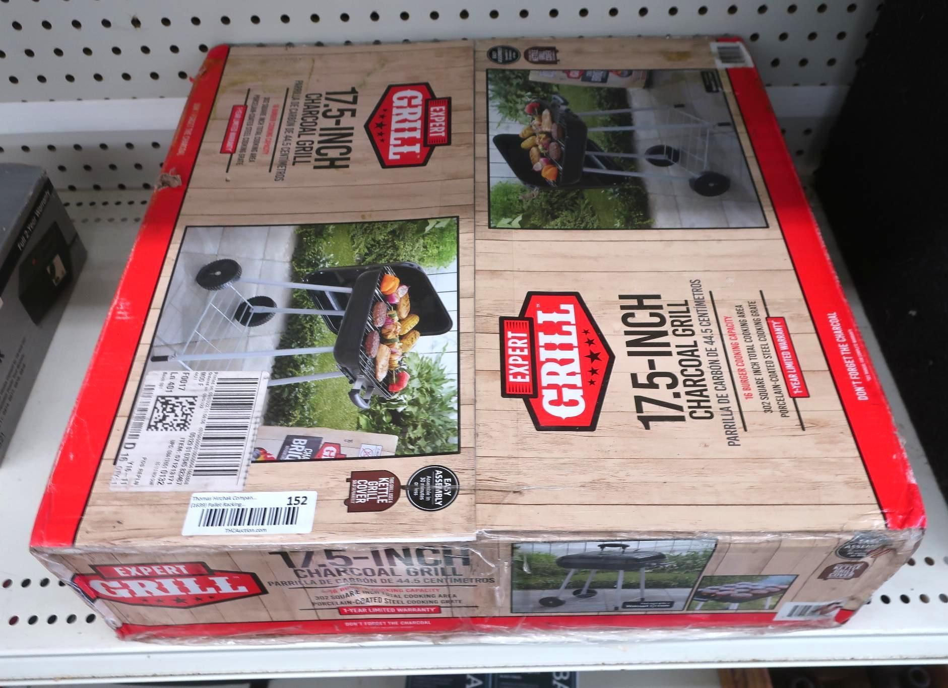 Boxed charcoal grill on a store shelf, showing grilling photos and product details.