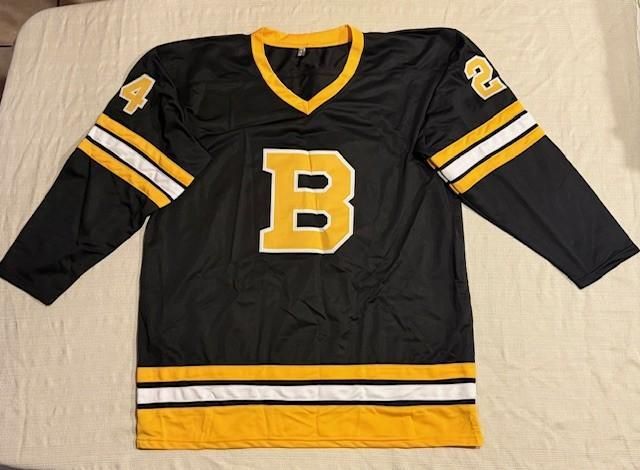 Black hockey jersey with a yellow