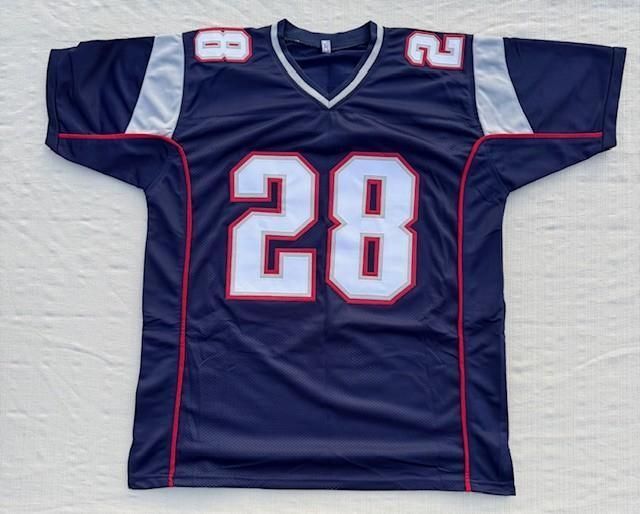 Navy blue football jersey with white and red accents; number 28.