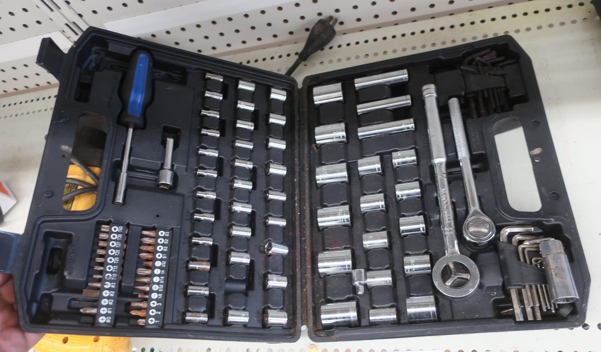 Open toolbox filled with sockets, ratchets, screwdriver, and Allen wrenches.