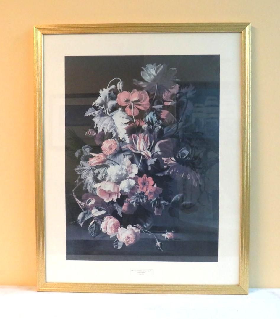 Framed floral still life with pink and white flowers against a dark background.
