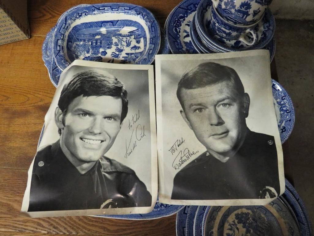 Two signed photos of actors in police uniforms.