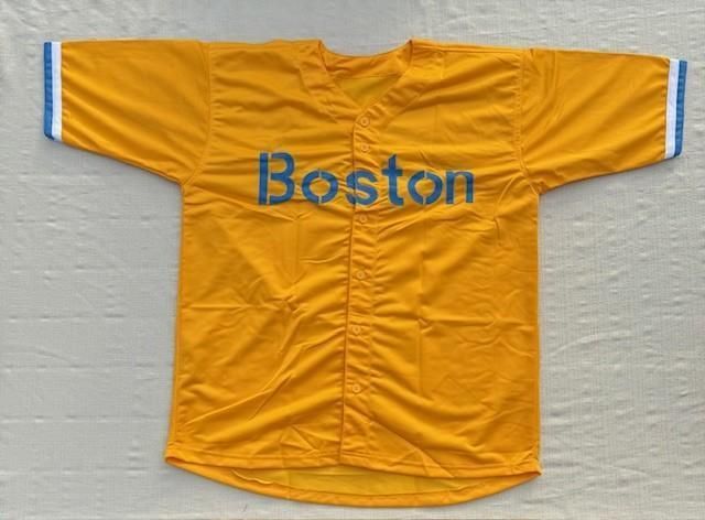 Yellow Boston baseball jersey with blue lettering and trim.