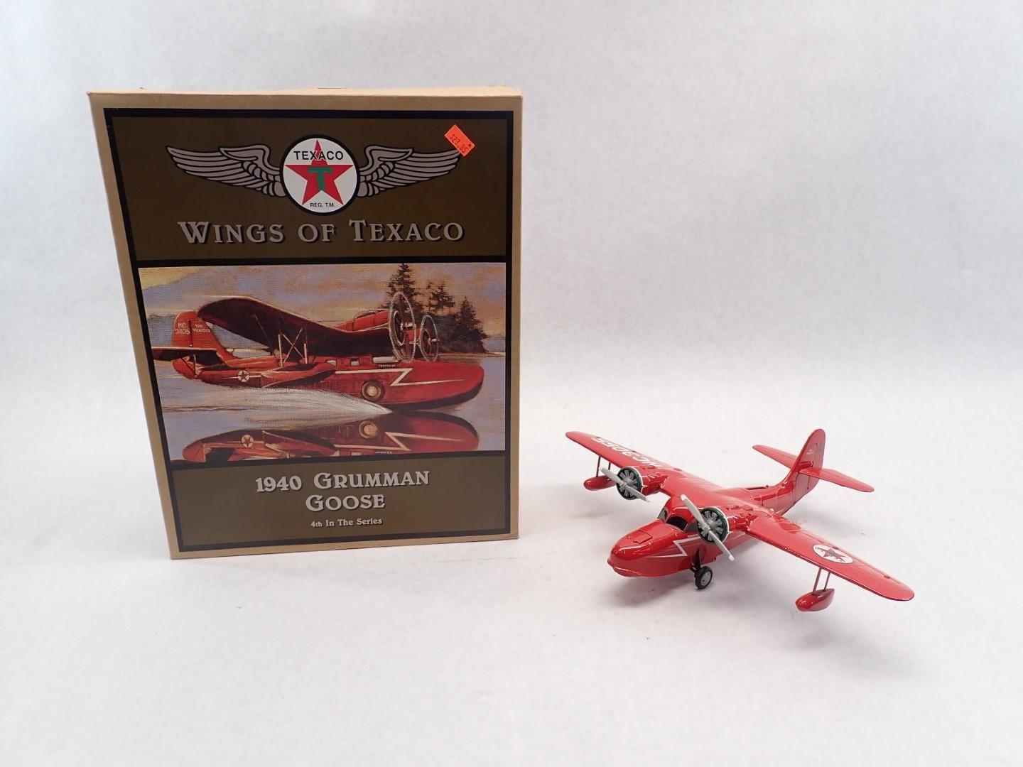 Red model airplane and box labeled