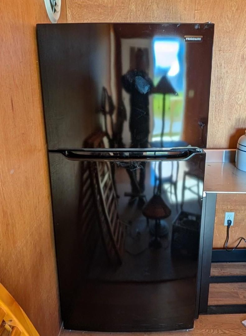 Black refrigerator with a handle