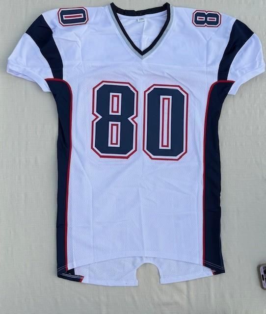 White football jersey with the number 80 in blue and red accents.
