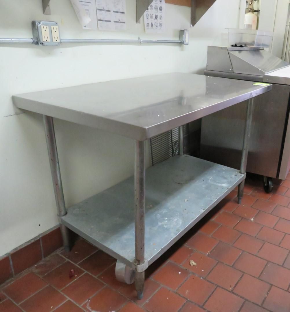 Stainless steel work table in a kitchen.