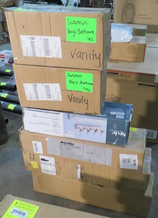 Cardboard boxes stacked, some labeled