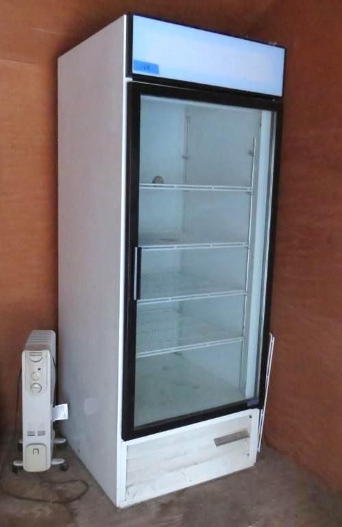White commercial refrigerator with glass door and three shelves.