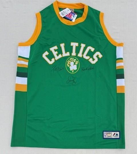 Green Boston Celtics jersey with gold and white accents, signed in multiple locations.