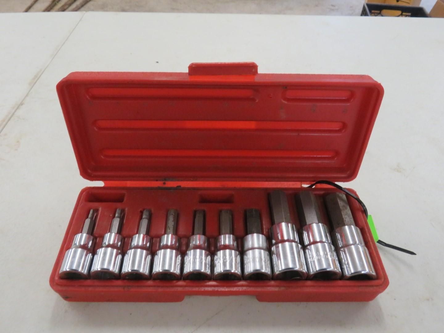 Red plastic case open, holding a set of chrome-colored hex-bit sockets.