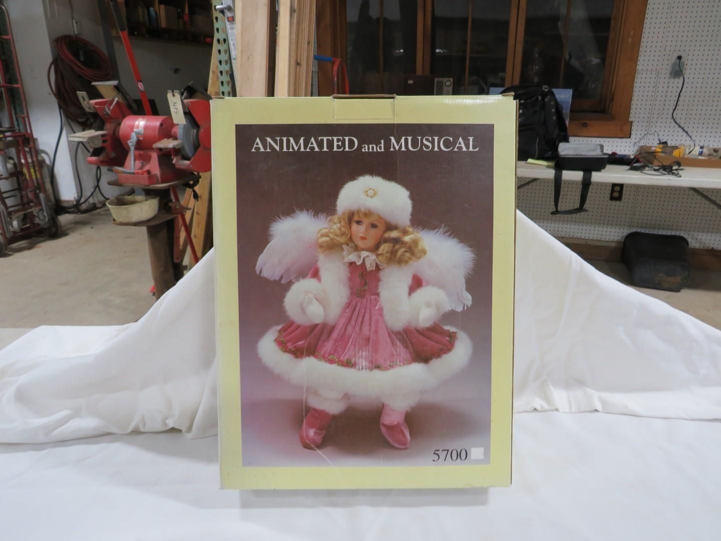 Box showing an animated, musical angel with pink and white clothing.
