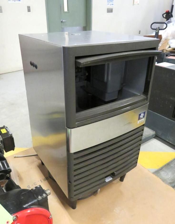 Stainless steel commercial ice machine.