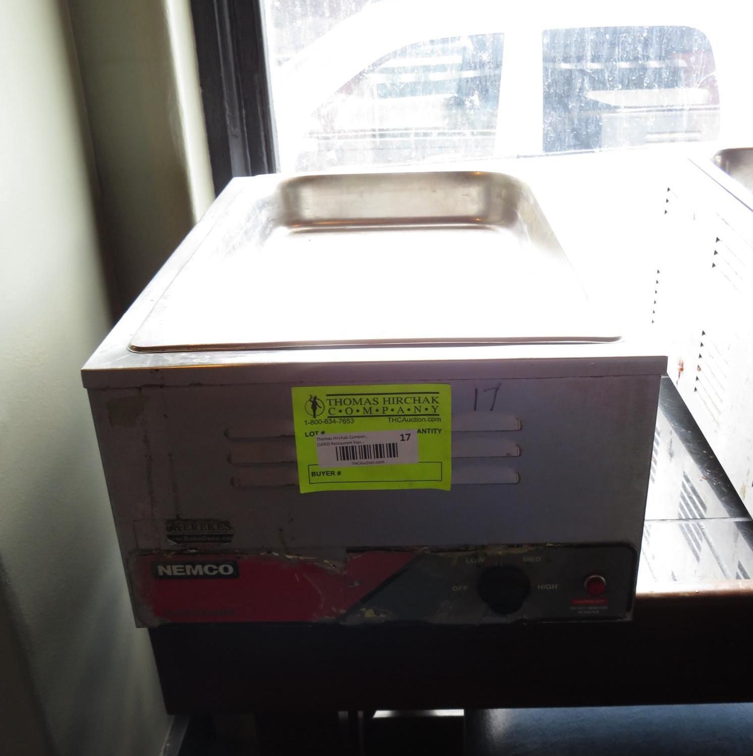 A stainless steel food warmer with a rectangular pan on top, control dial on front.