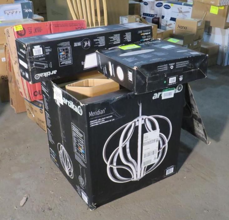 Boxes of lighting fixtures stacked, black and white packaging.