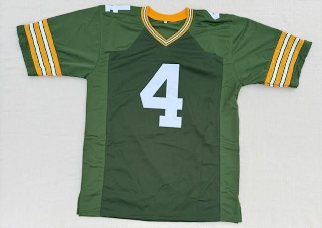 Green football jersey with number 4, white numbers, and yellow/white sleeve stripes.