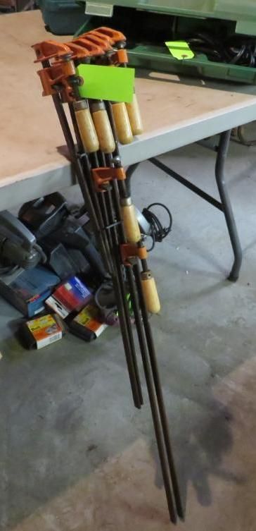 Clamps leaning on a table.
