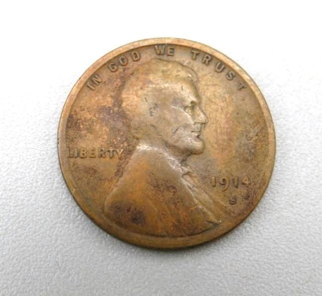 A 1914-S Lincoln penny, bronze color, showing Abraham Lincoln's profile; text: