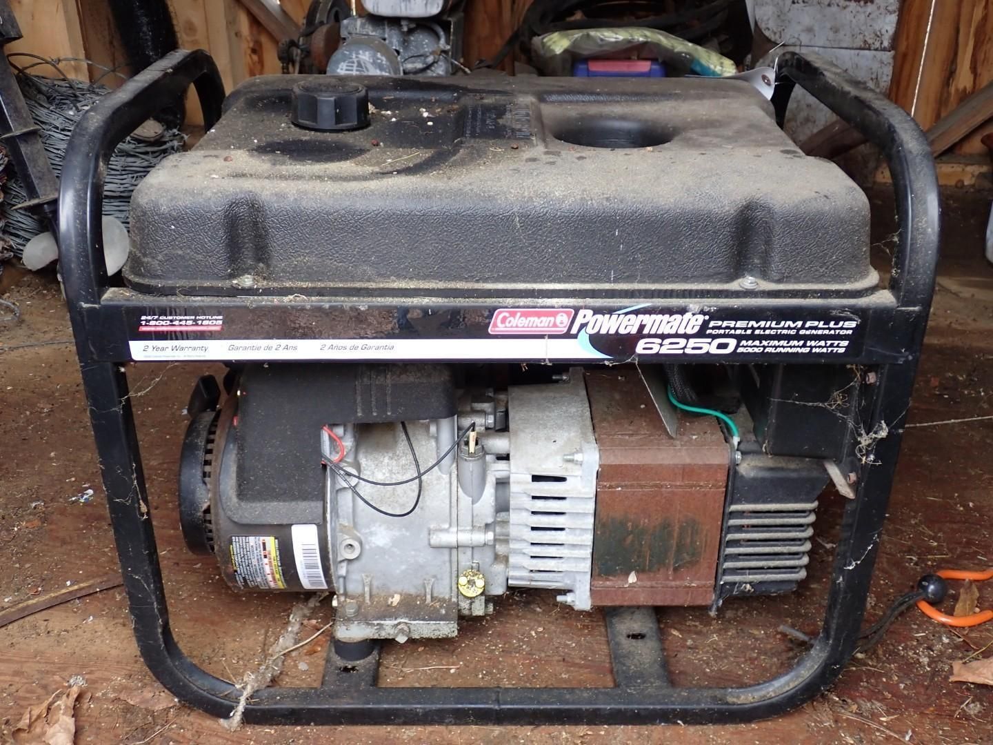 A Coleman Powermate 6250 generator with a black frame and fuel tank.