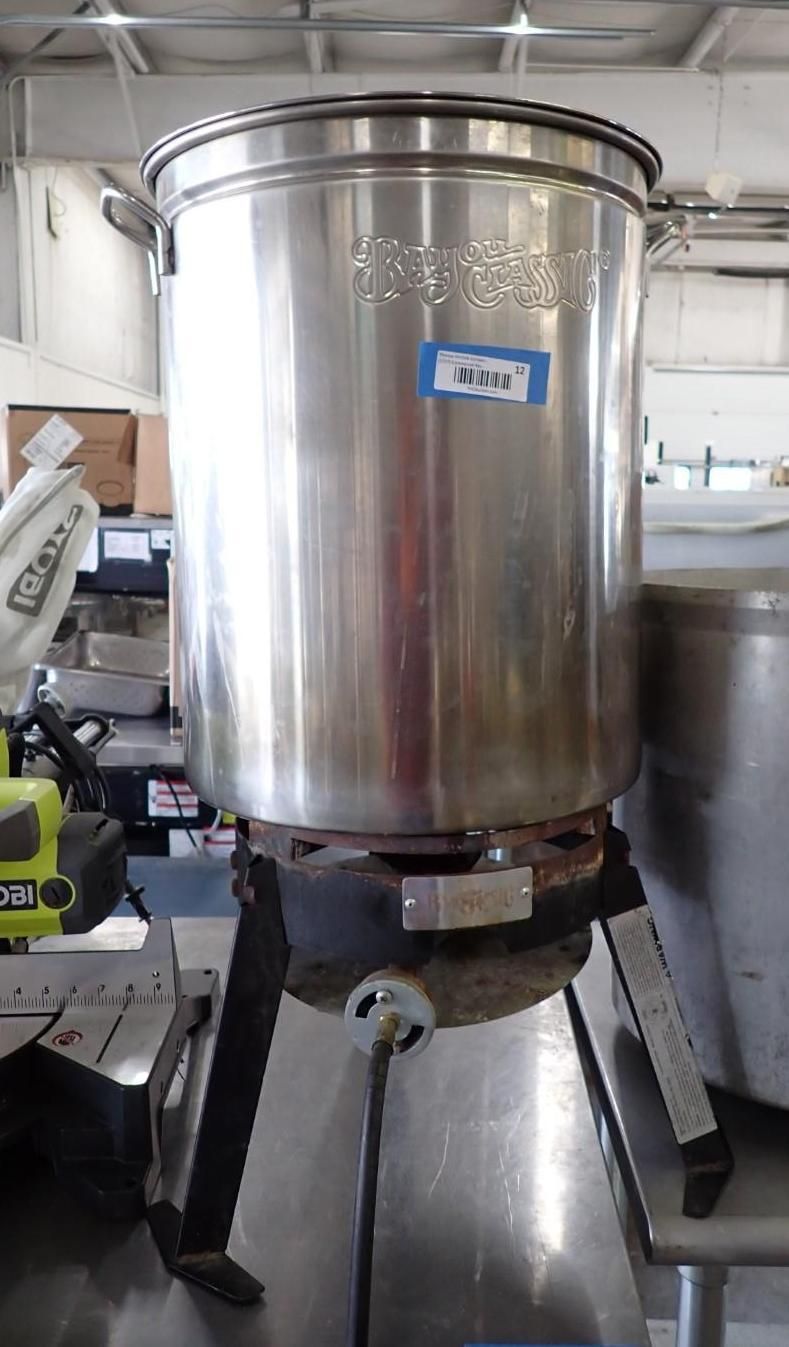 Large stainless steel industrial mixing tank on a stand