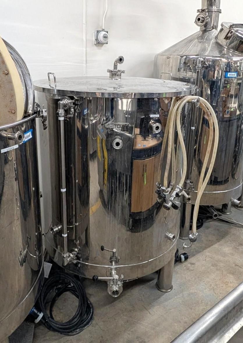 Stainless steel industrial tanks and piping in a clean manufacturing room