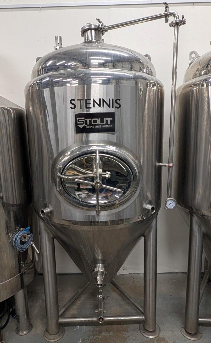 Stainless steel industrial tank with round window and pipes