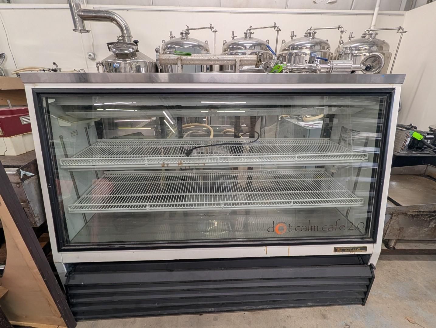 Empty glass display refrigerator in a commercial kitchen
