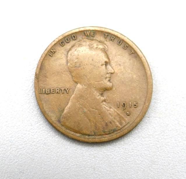 1915 Lincoln wheat penny, copper-colored, with Lincoln's profile and text