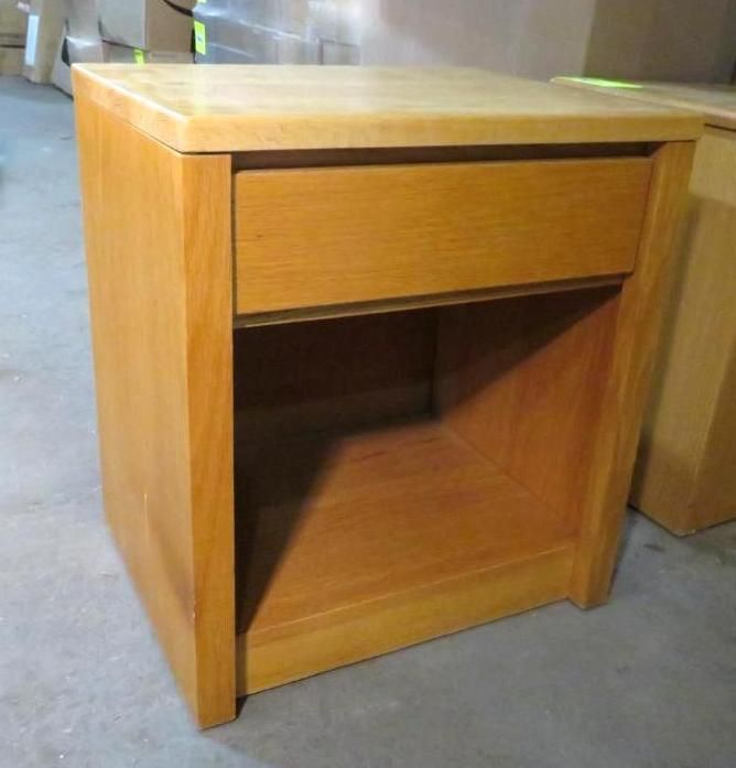 Wooden nightstand with drawer and open shelf.