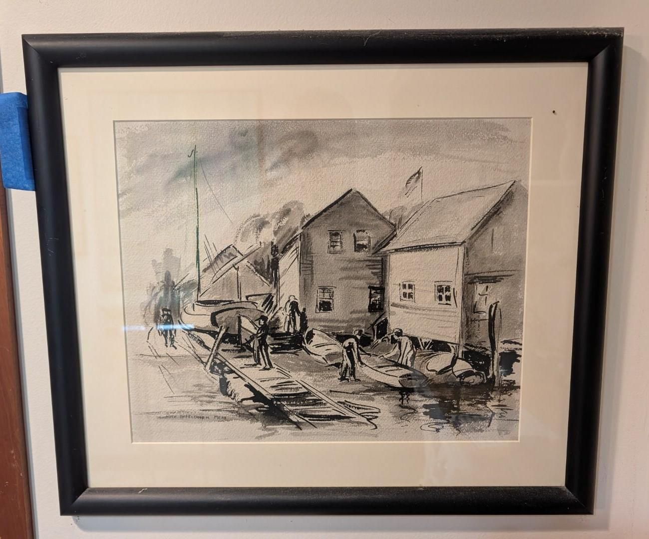 A framed, monochromatic ink wash sketch of a harbor scene with wooden buildings, small boats, and figures on a dock.