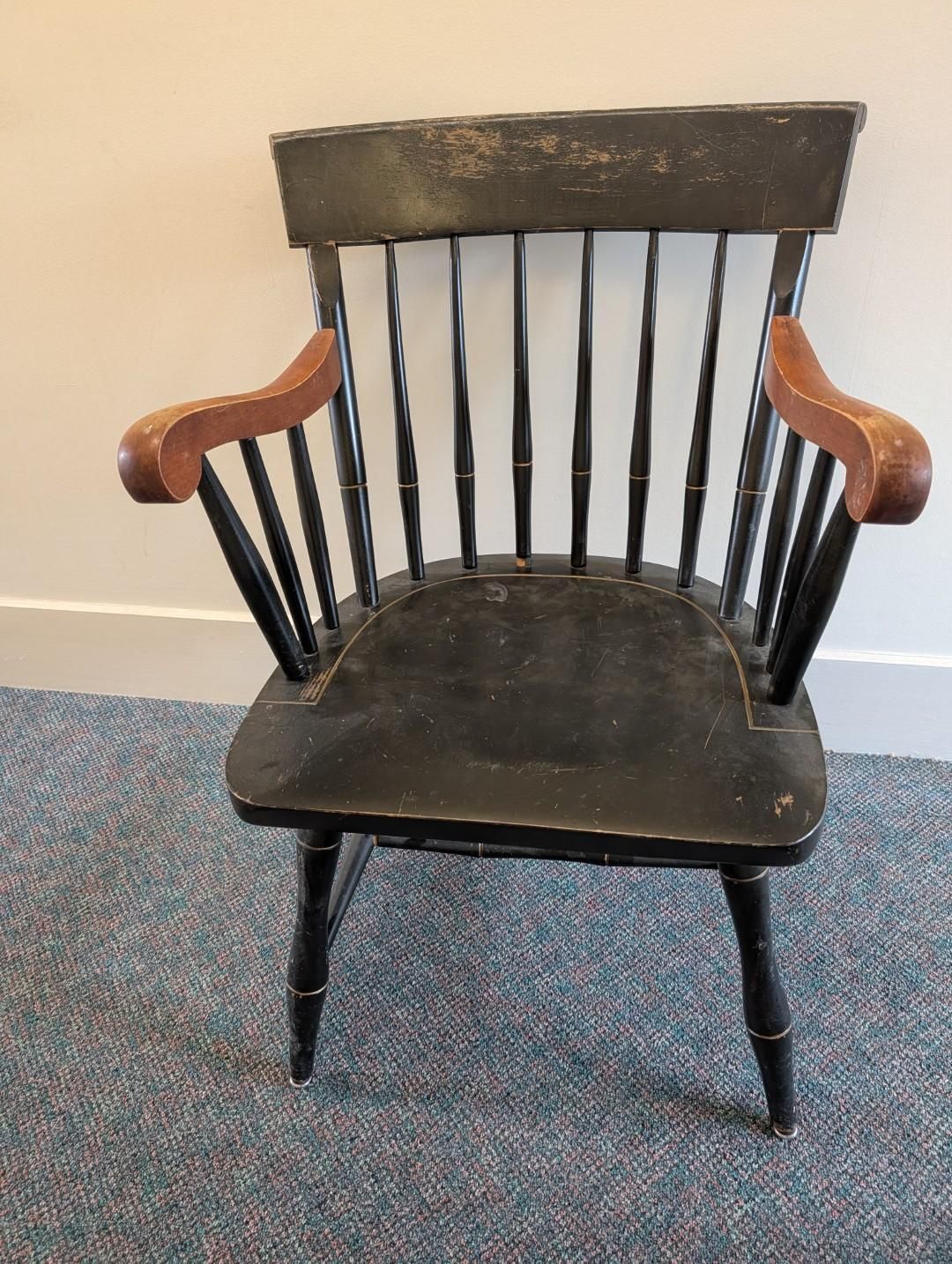 Black wooden Windsor chair with curved arms