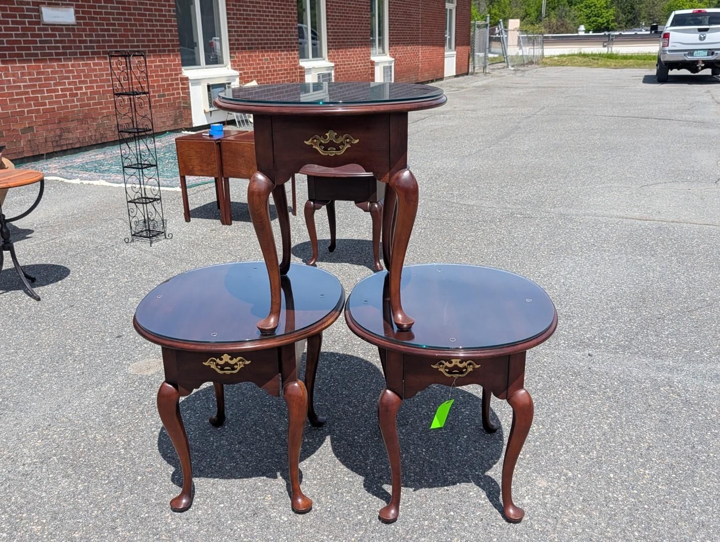 Three small dark wooden side tables