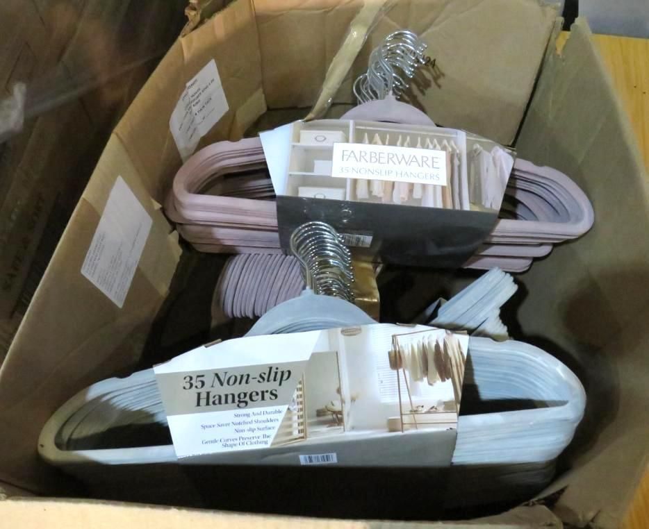 Box of non-slip hangers, various colors, stacked inside.