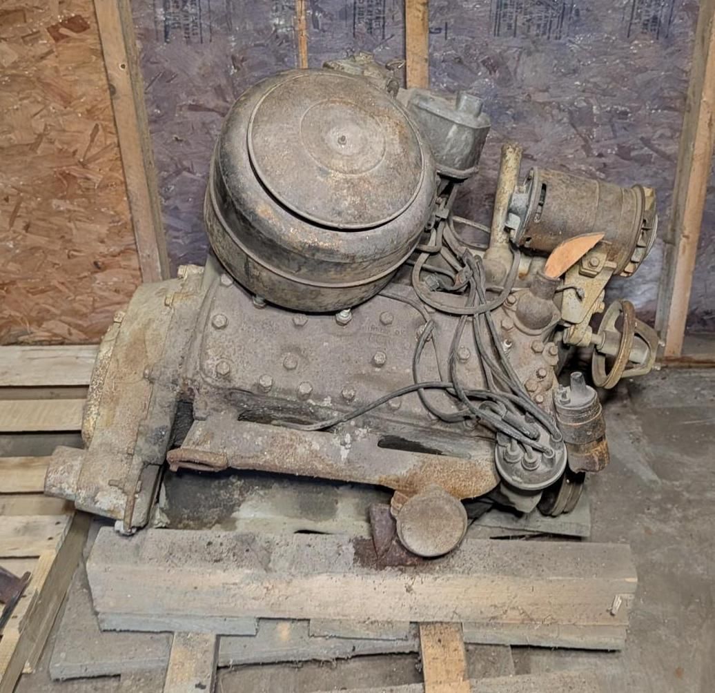 engine or compressor unit with pipes and wires in a worn wooden room